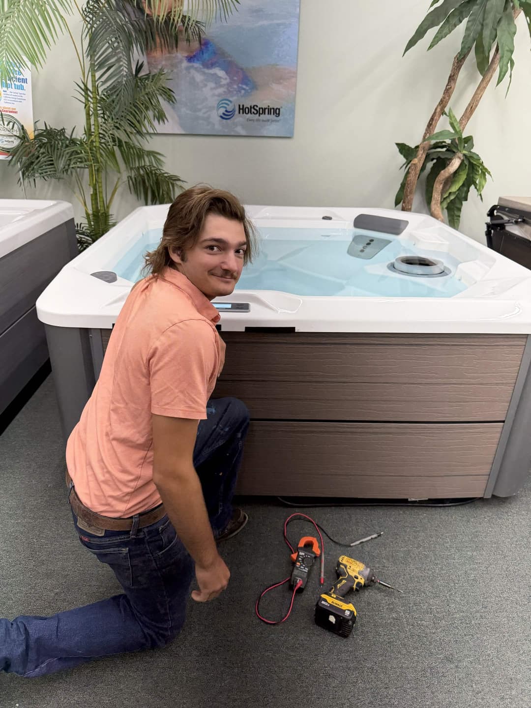 Sensible Spa Solutions technician servicing a Hot Spring portable hot tub